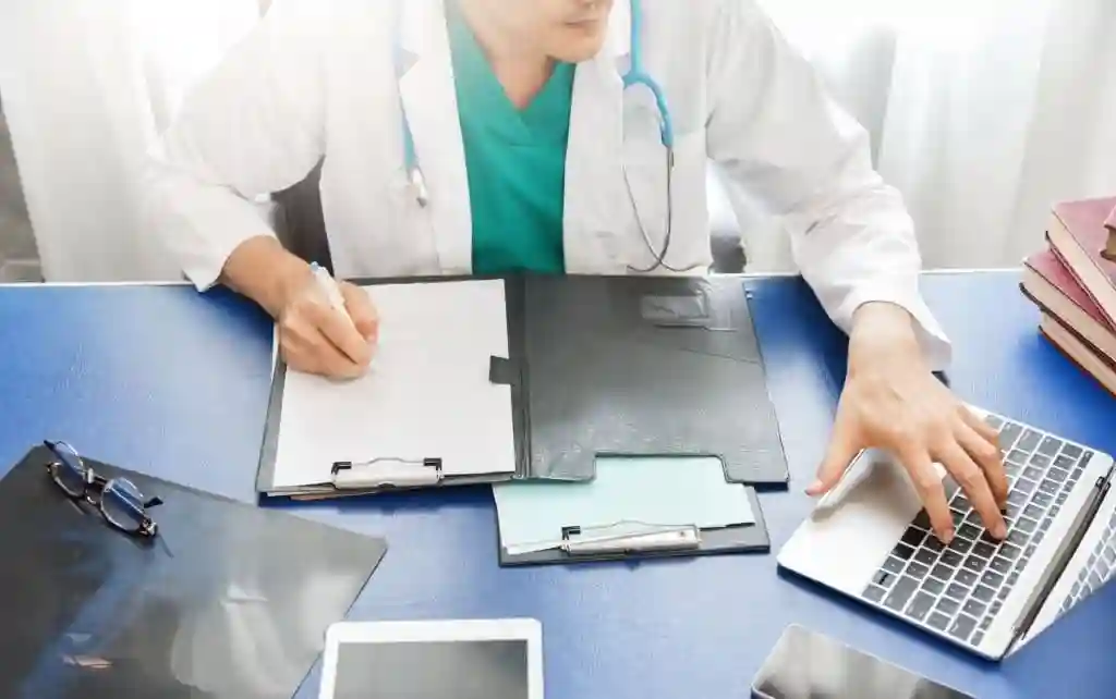 doctor with laptop image